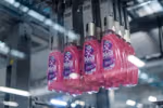 Bottles of Persil Wonder Wash on a factory production line.